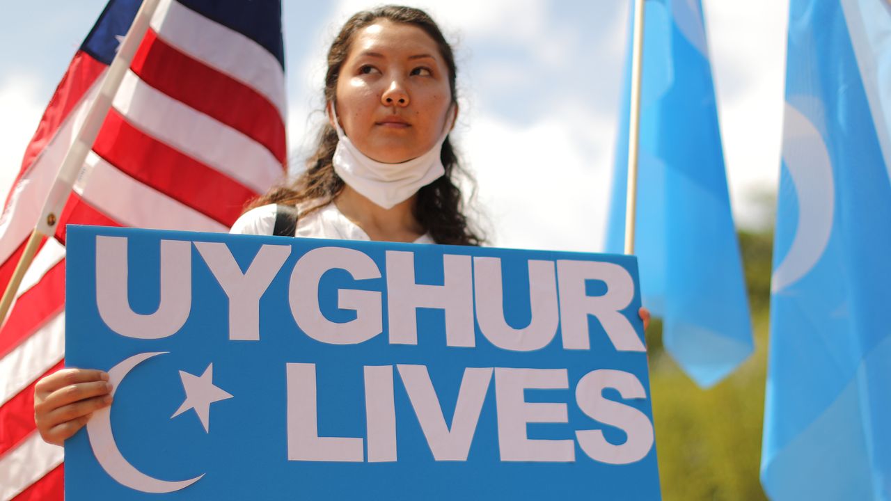 A protestor joins at a rally outside the White House