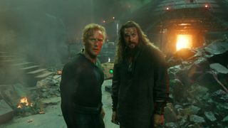 Orm and Aquaman stand in front of some wreckage in Aquaman 2