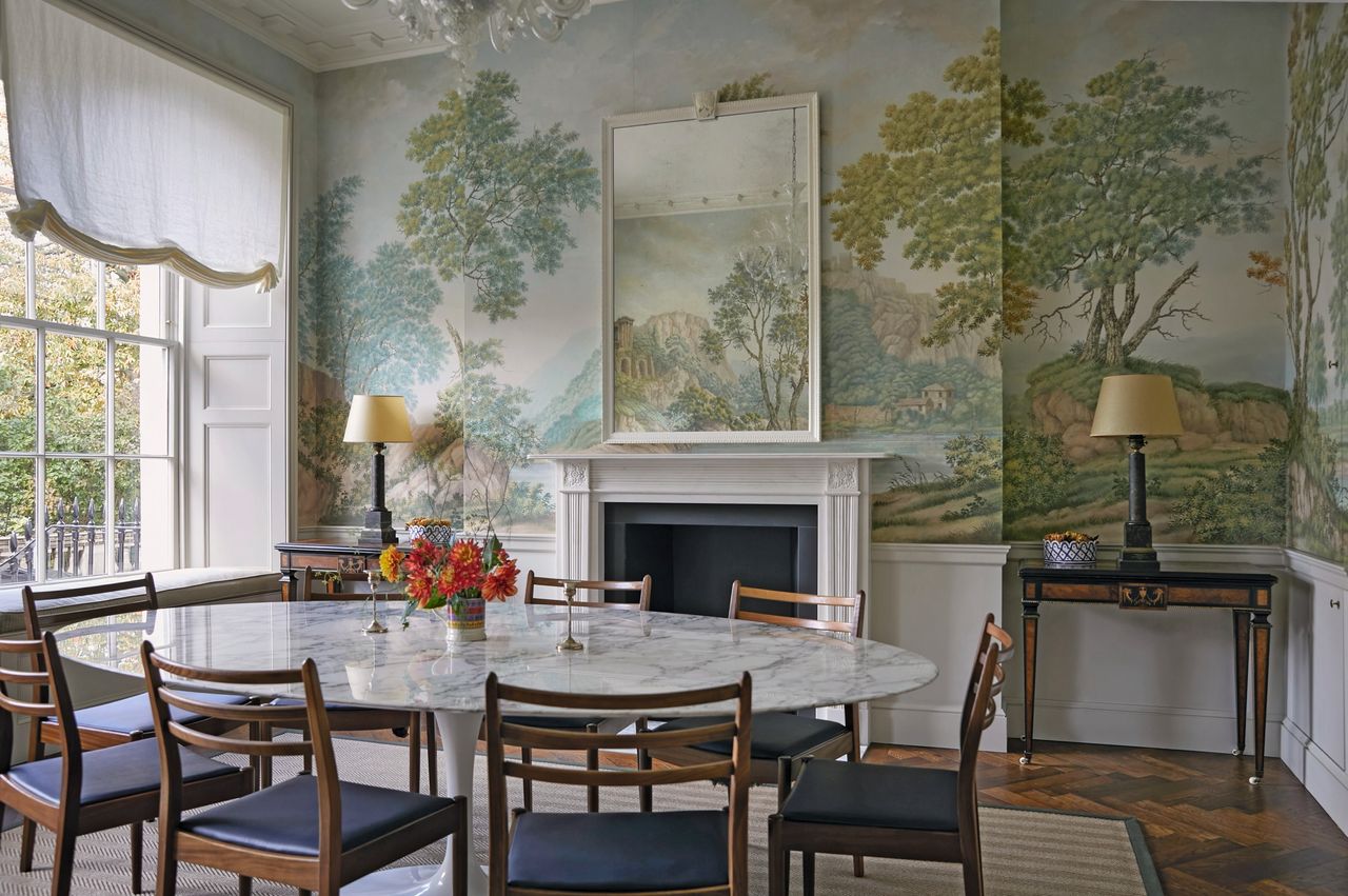 The dining room of a Regent’s Park house decorated by Ben Pentreath, with a mural by Alasdair Peebles and table by Eero Saarinen.