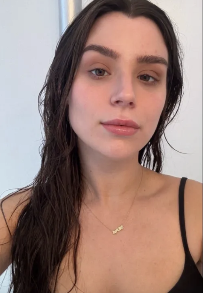 a girl with brown long hair before using Chanel Les Beiges Water-Fresh Complexion Touch.