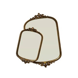 Two mirror trinket trays with a gold border