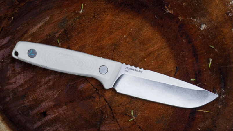 Leatherman Trac knife on a log