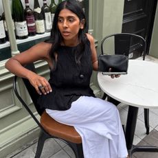 woman wearing black and white top