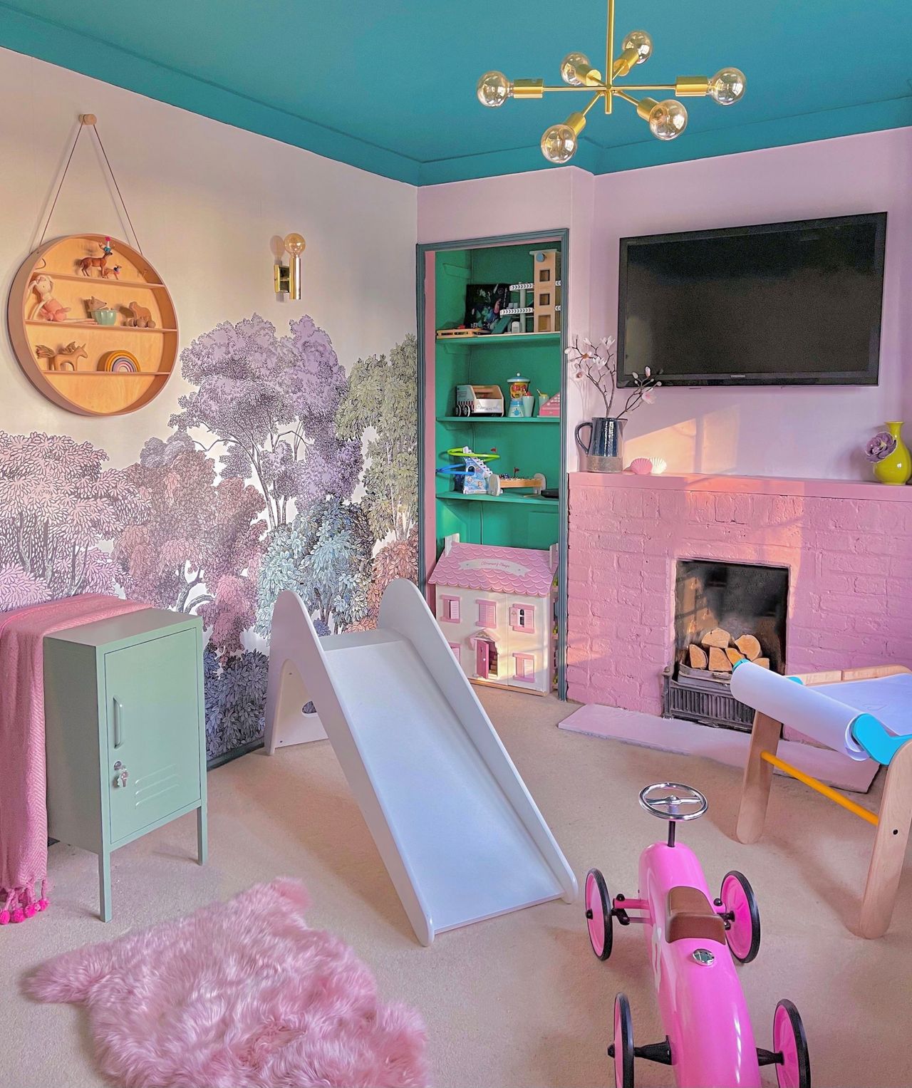 Child's playroom redesigned to give pink interior and slide