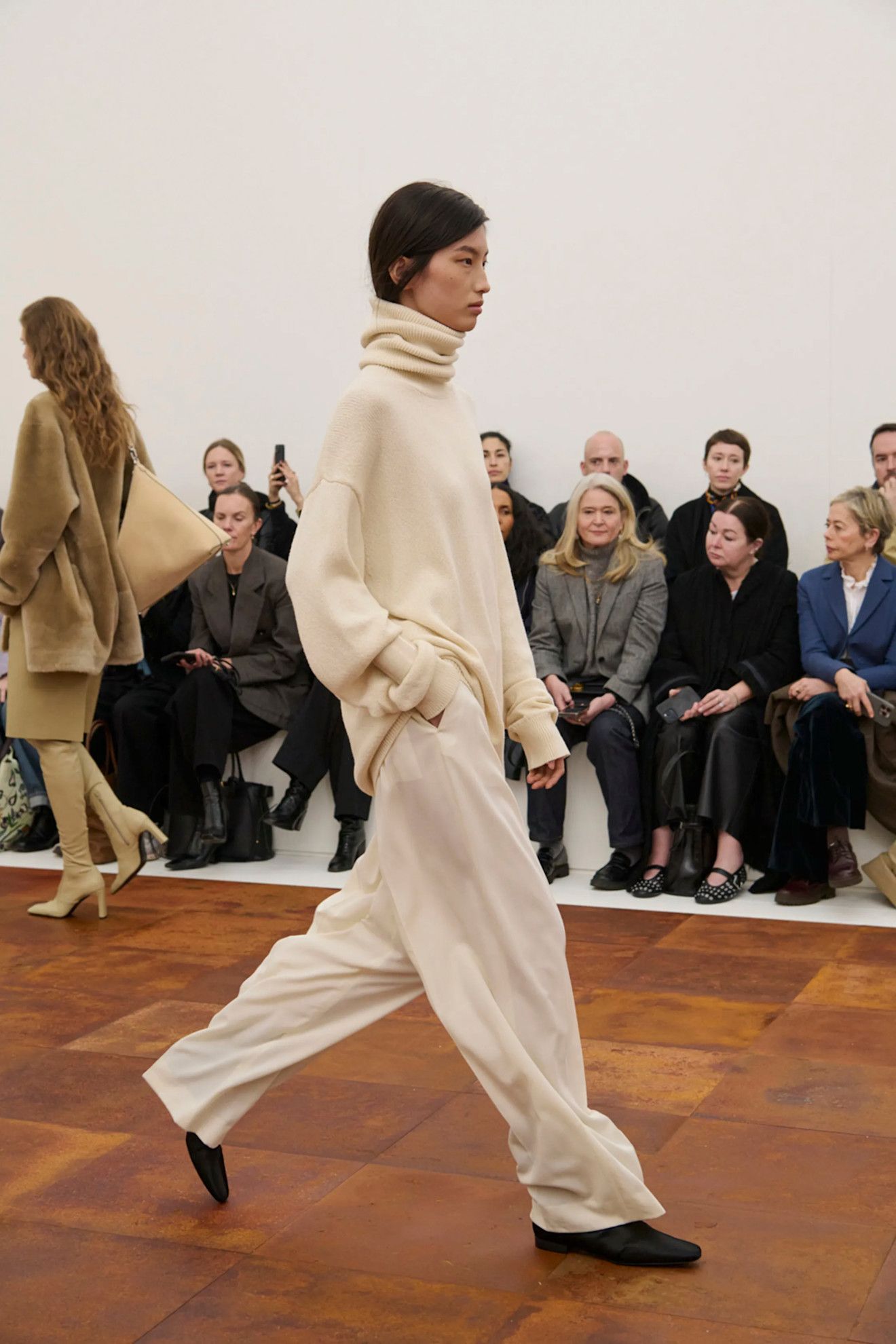 Toteme runway featuring the flat sock boot trend