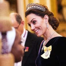 Catherine, duchess of Cambridge talks to guests at an evening reception