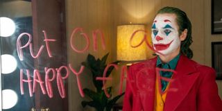 Joaquin Phoenix in Joker Put On A Happy Face written on mirror