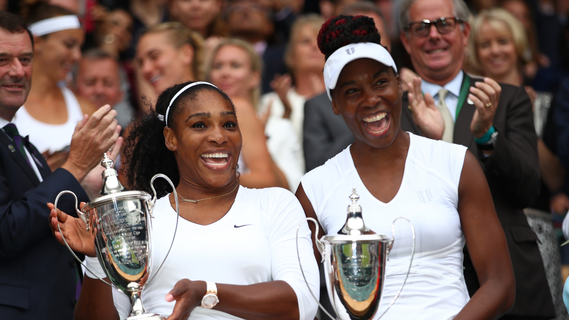 Serena and Venus Williams wear matching white tennis outfits at Wimbledon in 2016