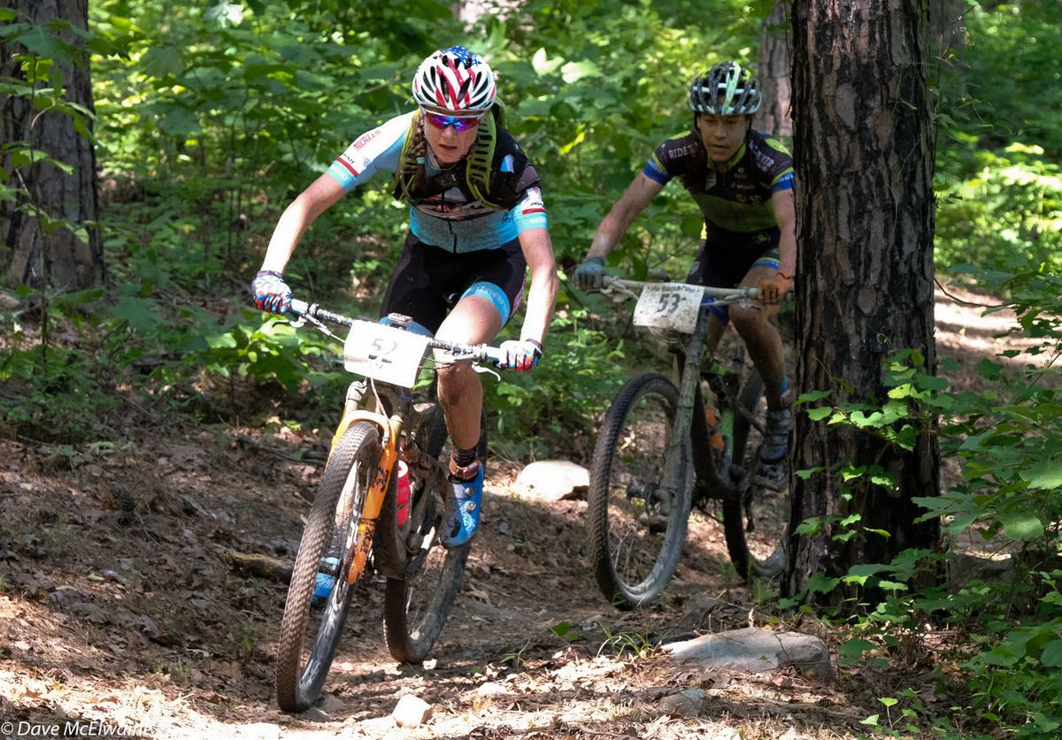 Rose Grant (Stans NoTubes-Pivot) leading Anthony with a half lap remaining