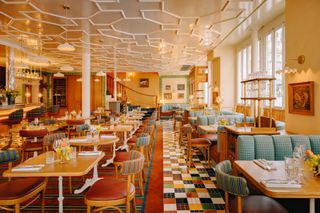 Overview of Public House Paris, boasting colorful flooring and seating