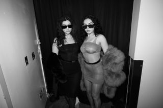 Charli XCX and Lorde in a black and white photo