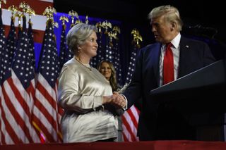 Donald Trump praises his campaign senior advisor Susie Wiles during an election night event at the Palm Beach Convention Center on November 06, 2024 in West Palm Beach, Florida.