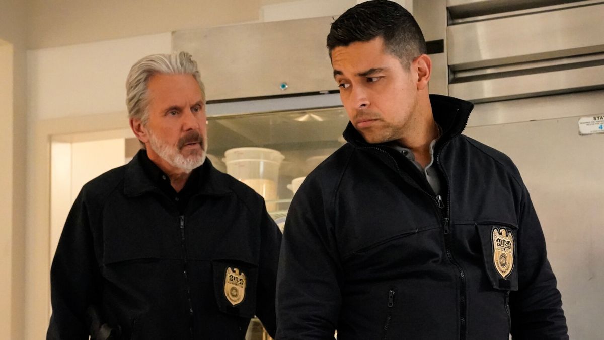 Gary Cole and Wilmer Valderrama exchange concerned looks at a crime scene in NCIS S22 E10 - &quot;Baker&#039;s Man.&quot;