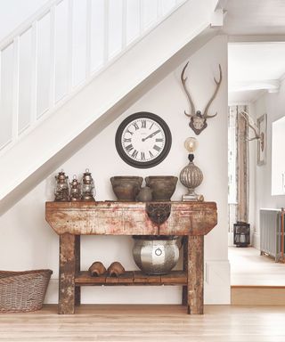 Wooden table, clock, antlers