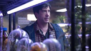 Goosebumps: The Vanishing still of David Schwimmer as retired dad Anthony in his basement