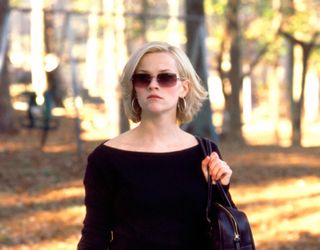 Reese Witherspoon wears oversized sunglasses and a black sweater in 'Sweet Home Alabama'