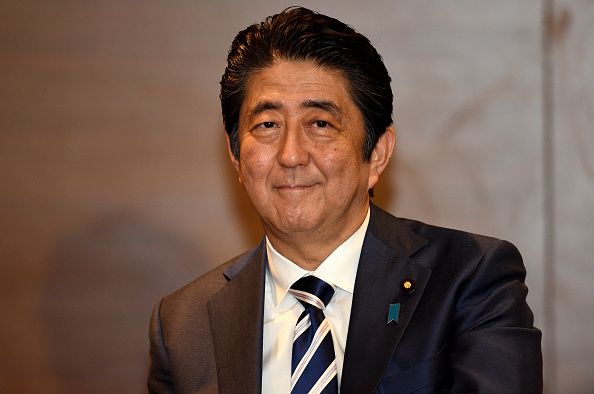 Japan&amp;#039;s Prime Minister Shinzo Abe smiles for the camera during a visit to Australia. 