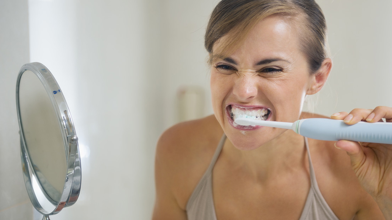 woman brushing teeth