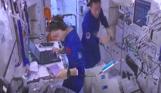 Shenzhou 14 astronauts work inside the Wentian space station module, which launched to Earth orbit on July 24, 2022.
