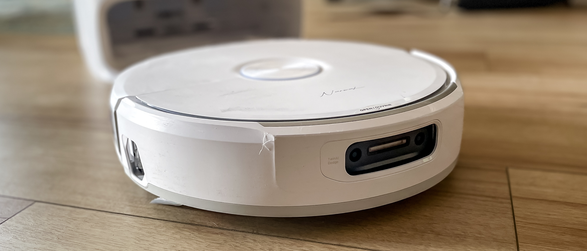 Narwal Freo 20 robot vacuum on a kitchen floor