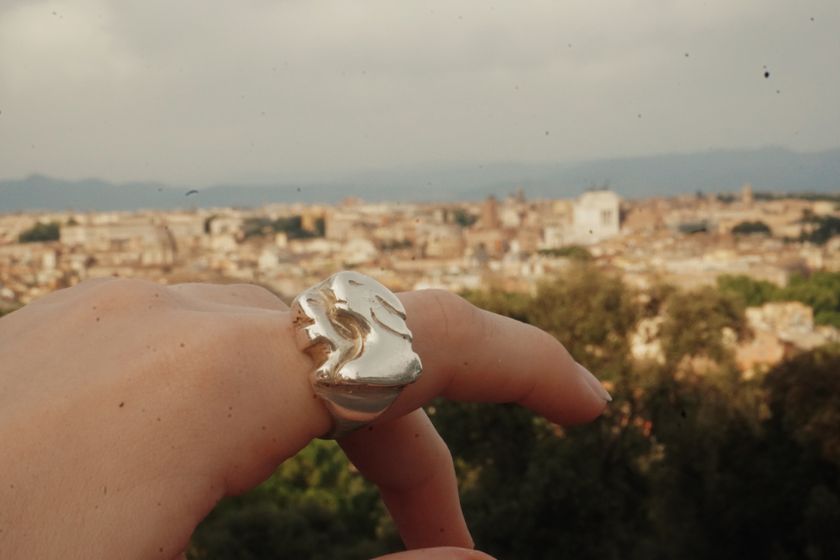 A close-up of my handmade silver ring against the Rome skyline.