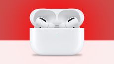 AirPods in case on red background