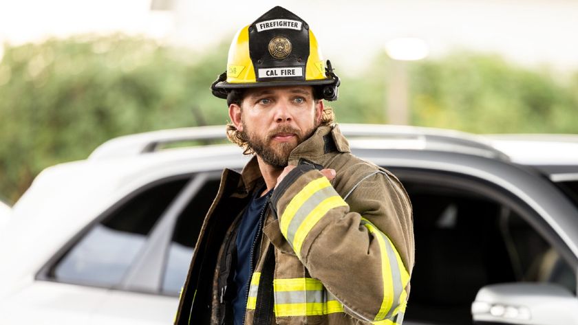 Max Thieriot as Bode Leone holding his right arm up next to his shoulder. 