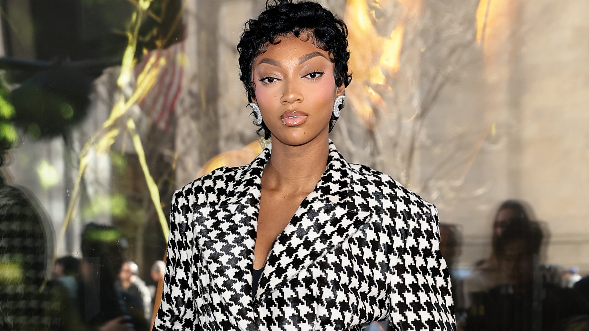 Angel Reese celebrated her Victoria's Secret campaign debut in a matching herringbone skirt set 