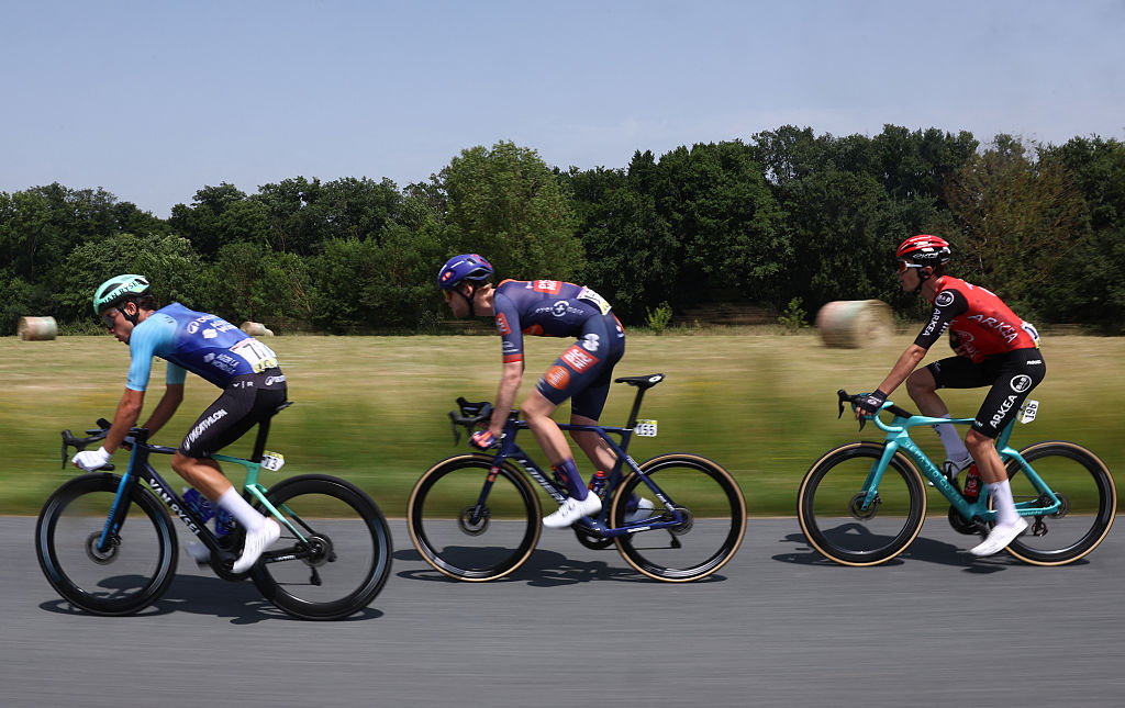 Decathlon AG2R La Mondiale Team's French rider Jordan Labrosse (L), Team Picnic PostNL's Dutch rider Enzo Leijnse and Arkéa-B&B Hotels' French rider Pierre Thierry cycle in a breakaway during the 5th stage of the 77th edition of the Criterium du Dauphine cycling race, 183 km between Saint-Priest and Mâcon, on June 12, 2025. (Photo by Anne-Christine POUJOULAT / AFP) (Photo by ANNE-CHRISTINE POUJOULAT/AFP via Getty Images)