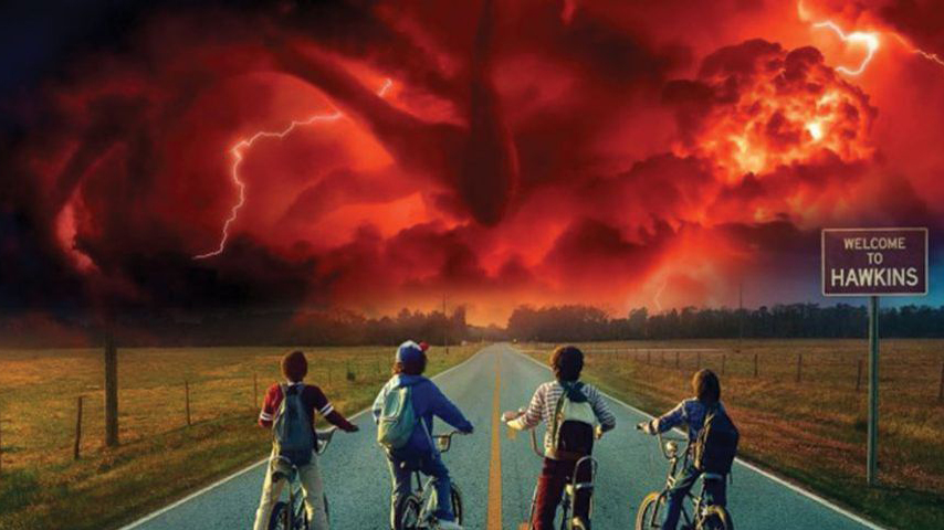 Mind Flayer towering above the kids from Stranger Things on their bikes