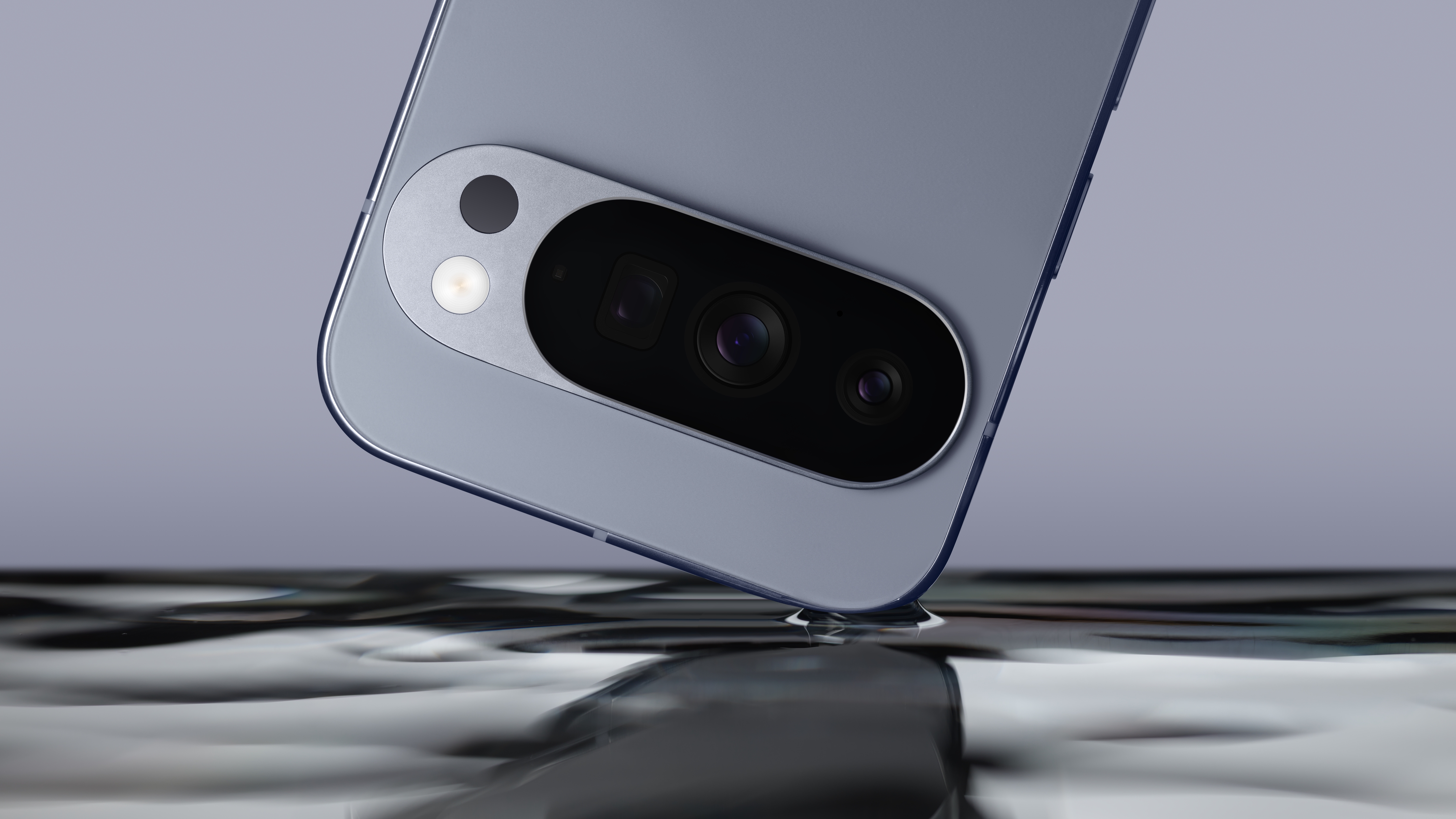 Google Pixel 10 cell phone above a metallic surface