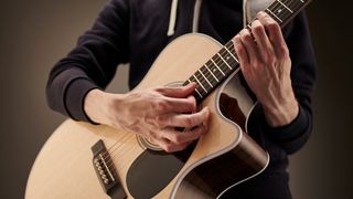 Man playing acoustic guitar