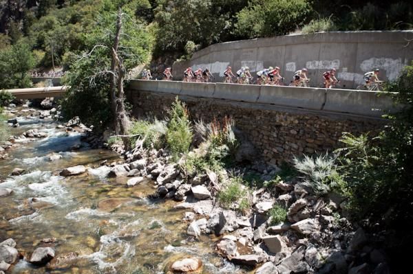 Riders pass by a creek on the way back down into Ogden.
