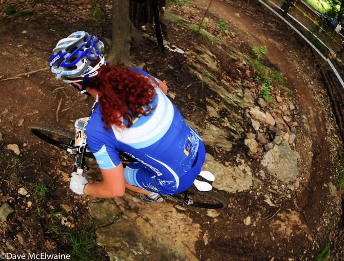 Teal Stetson-Lee (Luna Pro Team), famous for her red curls, rounds a switchback at the Catamount Pro-XCT race in Vermont