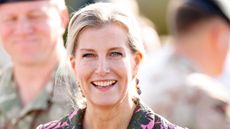 Duchess Sophie smiles, wearing a dark floral dress, as she attends a 5 RIFLES Homecoming Parade at Picton Barracks on October 4, 2024