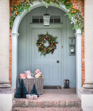 pale blue front door with rustic steps