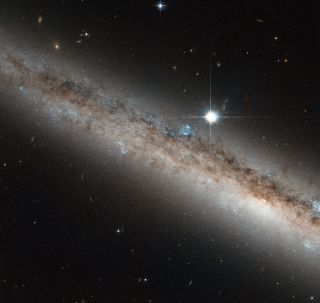 Spiral Galaxy NGC 4517 and Star