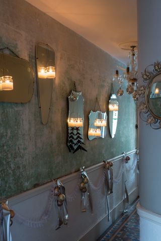 Small hallway with mirrors decorated for Christmas