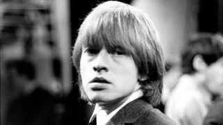 English guitarist Brian Jones (1942 - 1969) of the Rolling Stones on the set of the TV show 'Ready Steady Go!' in 1964
