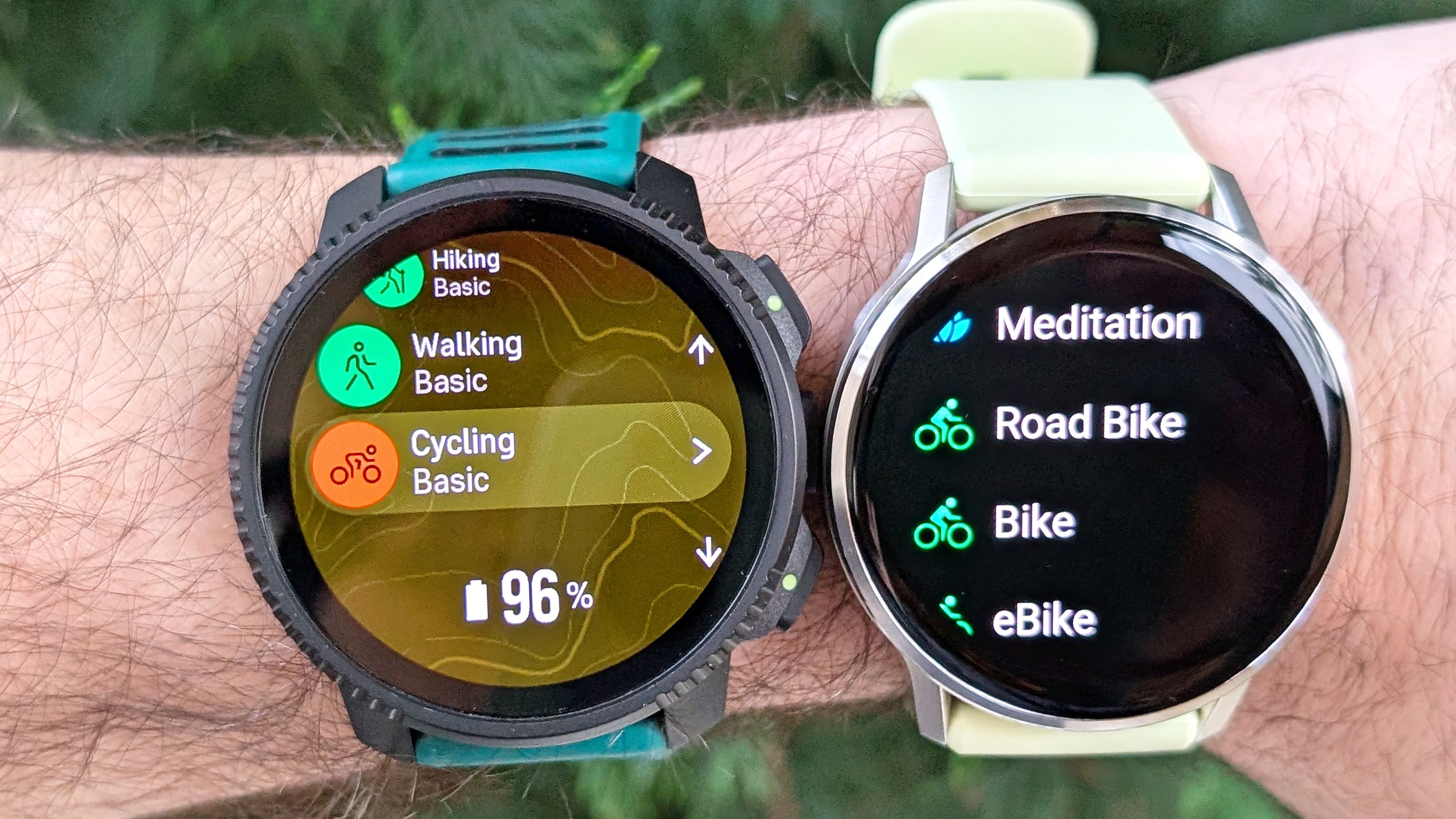 Close-up of the Garmin Venu 4 next to the Suunto Vertical 2