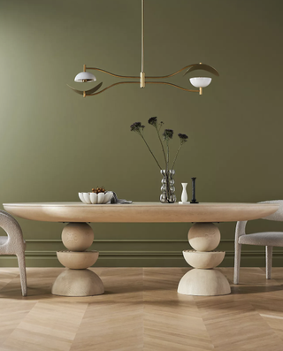 Sculptural natural wood double pedestal dining table from Anthropologie.