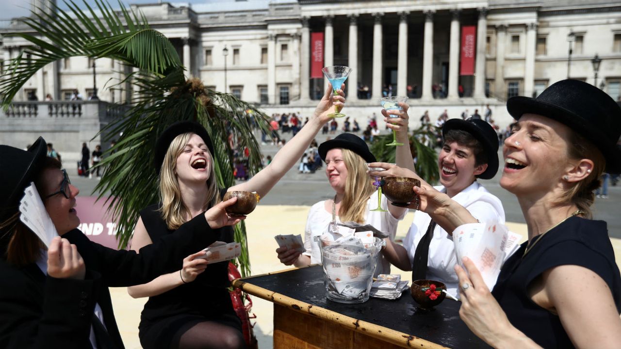 Protesters in mock celebration as part in a demonstration against tax evasion in London in 2016