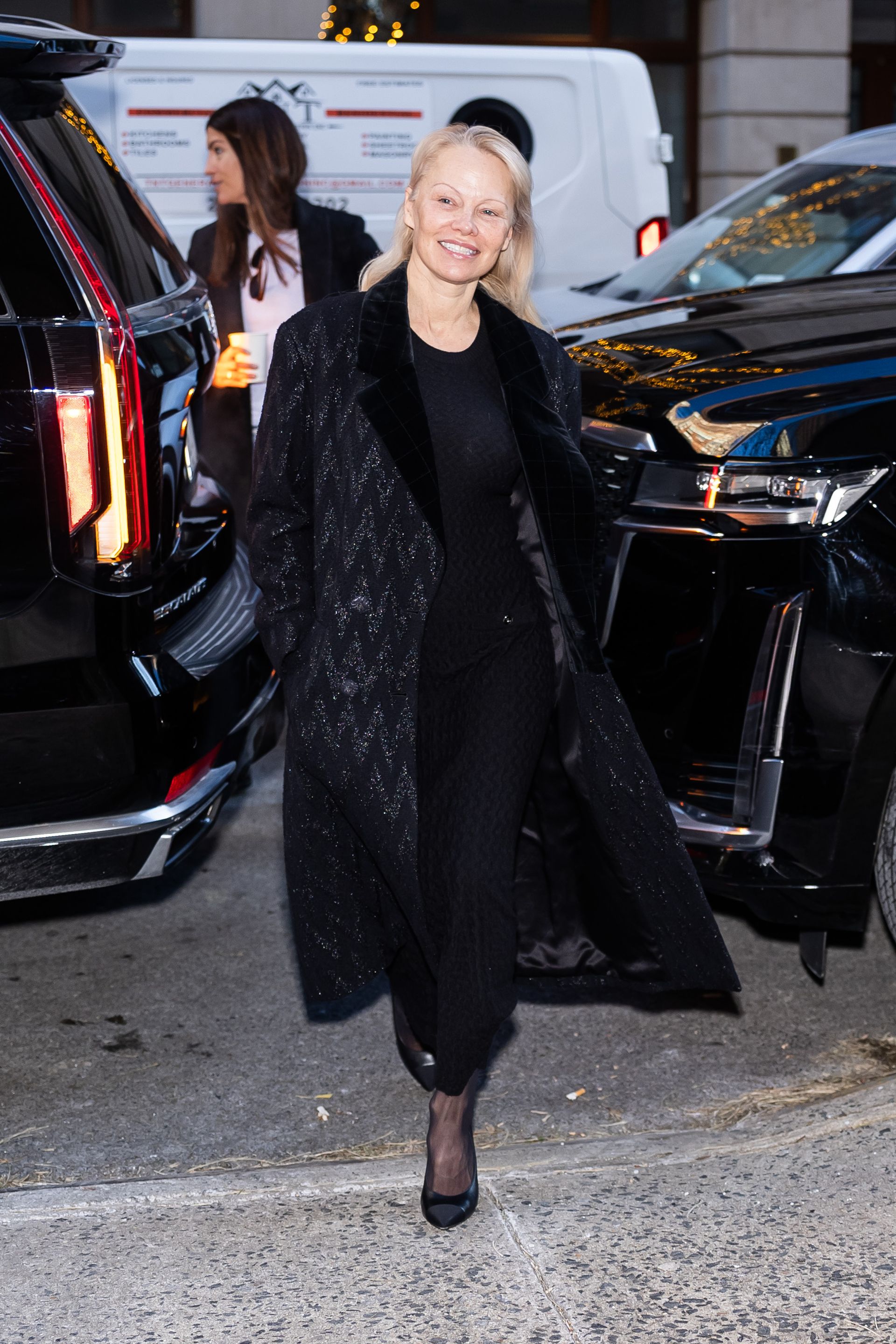 Pamela Anderson wears black tights.