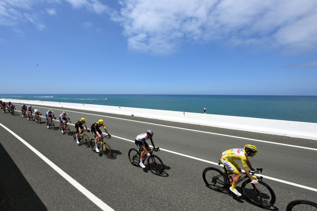 BAYONNE FRANCE JULY 03 LR Jonas Vingegaard of Denmark Nathan Van Hooydonck of Belgium and Team JumboVisma Rafal Majka of Poland Adam Yates of United Kingdom and UAE Team Emirates Yellow leader jersey y and a general view of the peloton competing during the stage three of the 110th Tour de France 2023 a 1935km stage from AmorebietaEtxano to Bayonne UCIWT on July 03 2023 in Bayonne France Photo by David RamosGetty Images