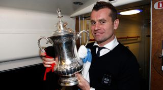 FA Cup, Final, Manchester City v Stoke City, Wembley Stadium, Manchester City goalkeeper Shay Given with the FA cup trophy on the train (Photo by Sharon Latham/Manchester City FC via Getty Images)