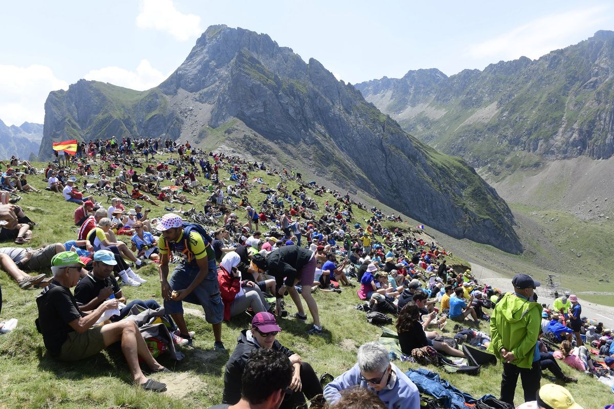 Somewhere deep in the Pyrenees, masses of fans await the peloton