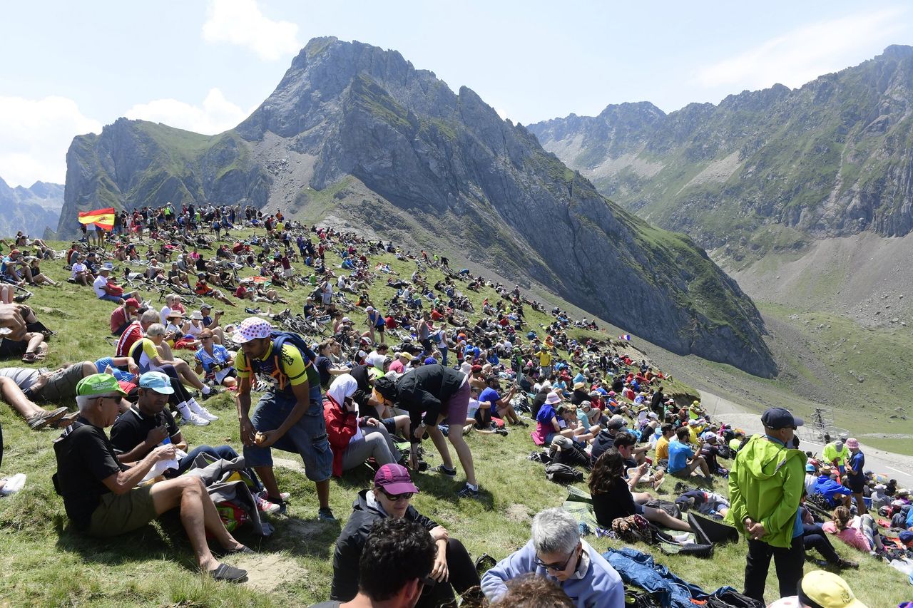 Somewhere deep in the Pyrenees, masses of fans await the peloton