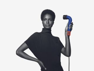 Dyson Supersonic r hair dryer held by model