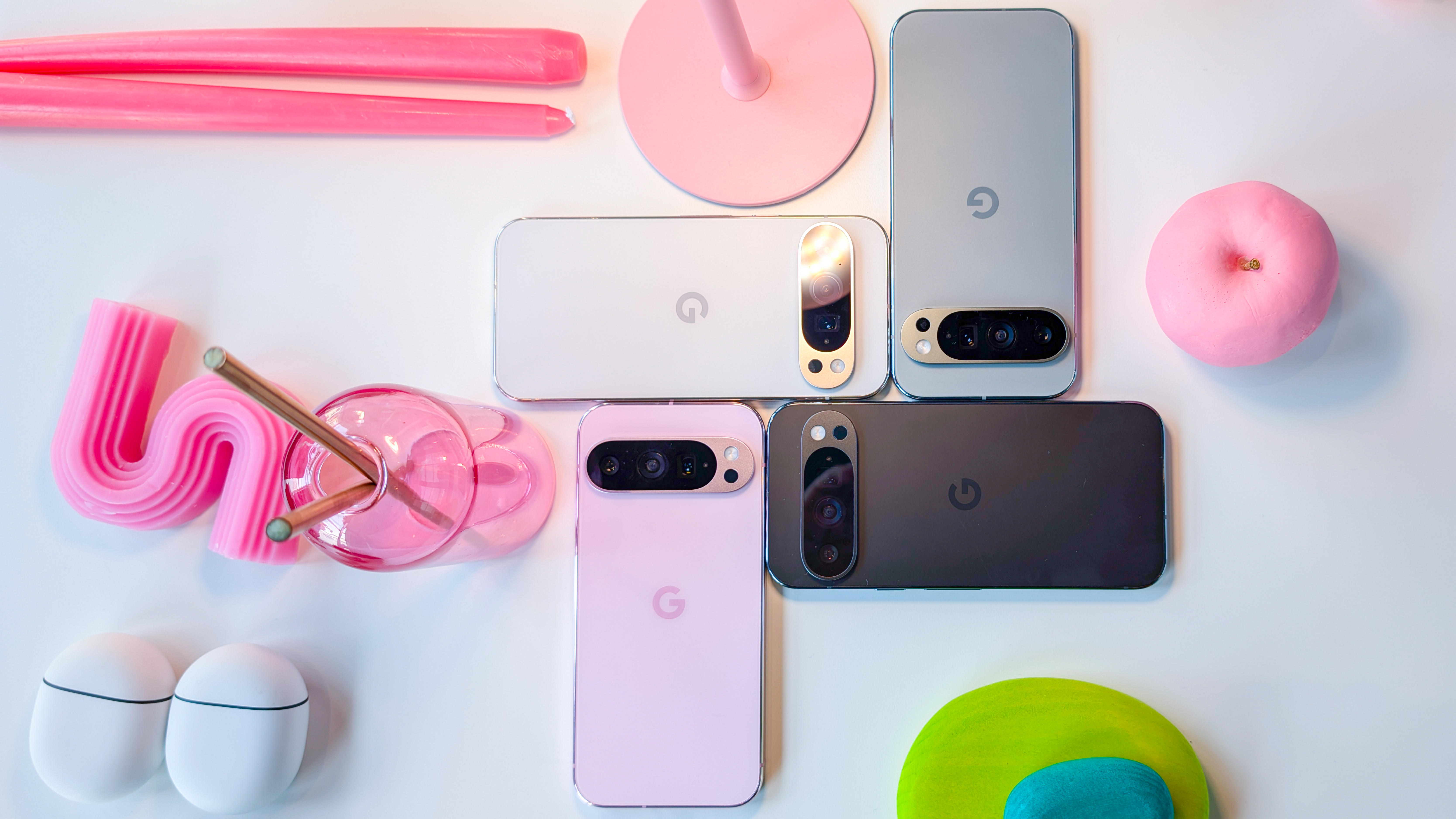 Pixel 9 Pro, clockwise arrangement showing back of Porcelain; Hazel; Obsidian; Rose Quartz