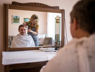 Russia's Mikhail Kornienko gets his hair cut ahead of his scheduled launch to the International Space Station for the orbiting outpost's first yearlong mission.